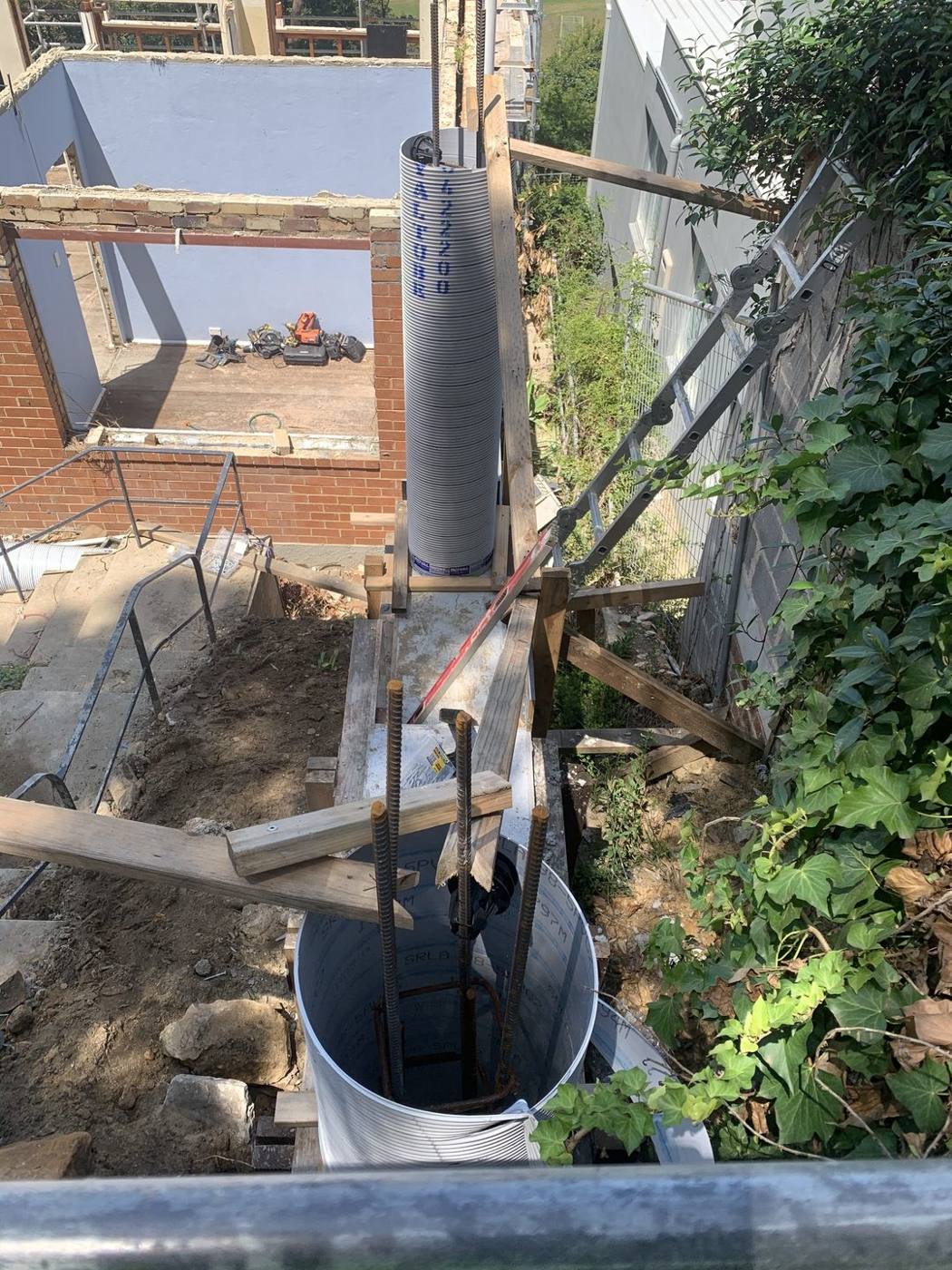 Close-up of a braced column form and reinforcement bars for a pier by Loel Homes