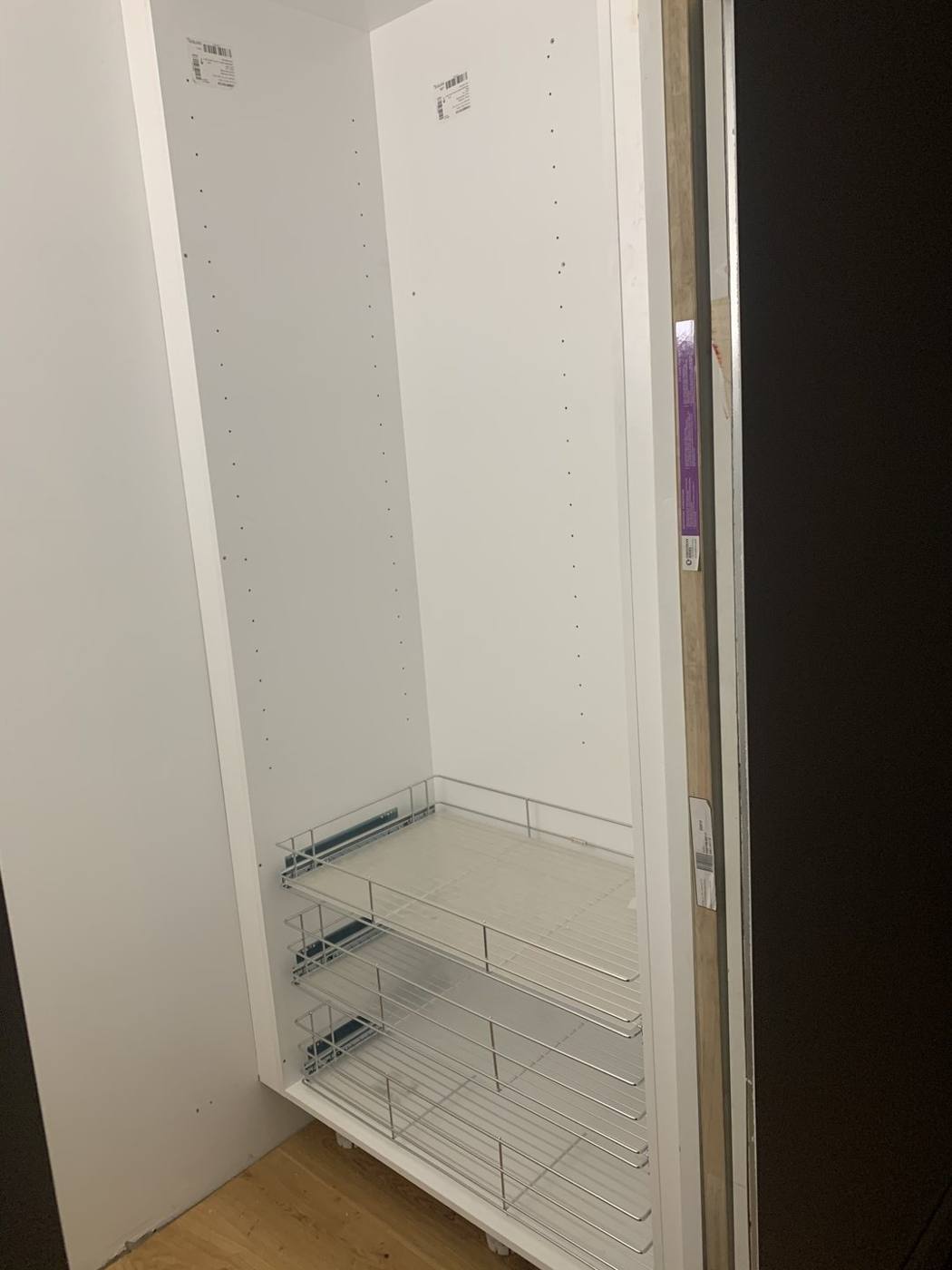 Tall butler's pantry cabinet with chrome pull-out wire basket drawers installed, Dulwich Hill by Loel Homes