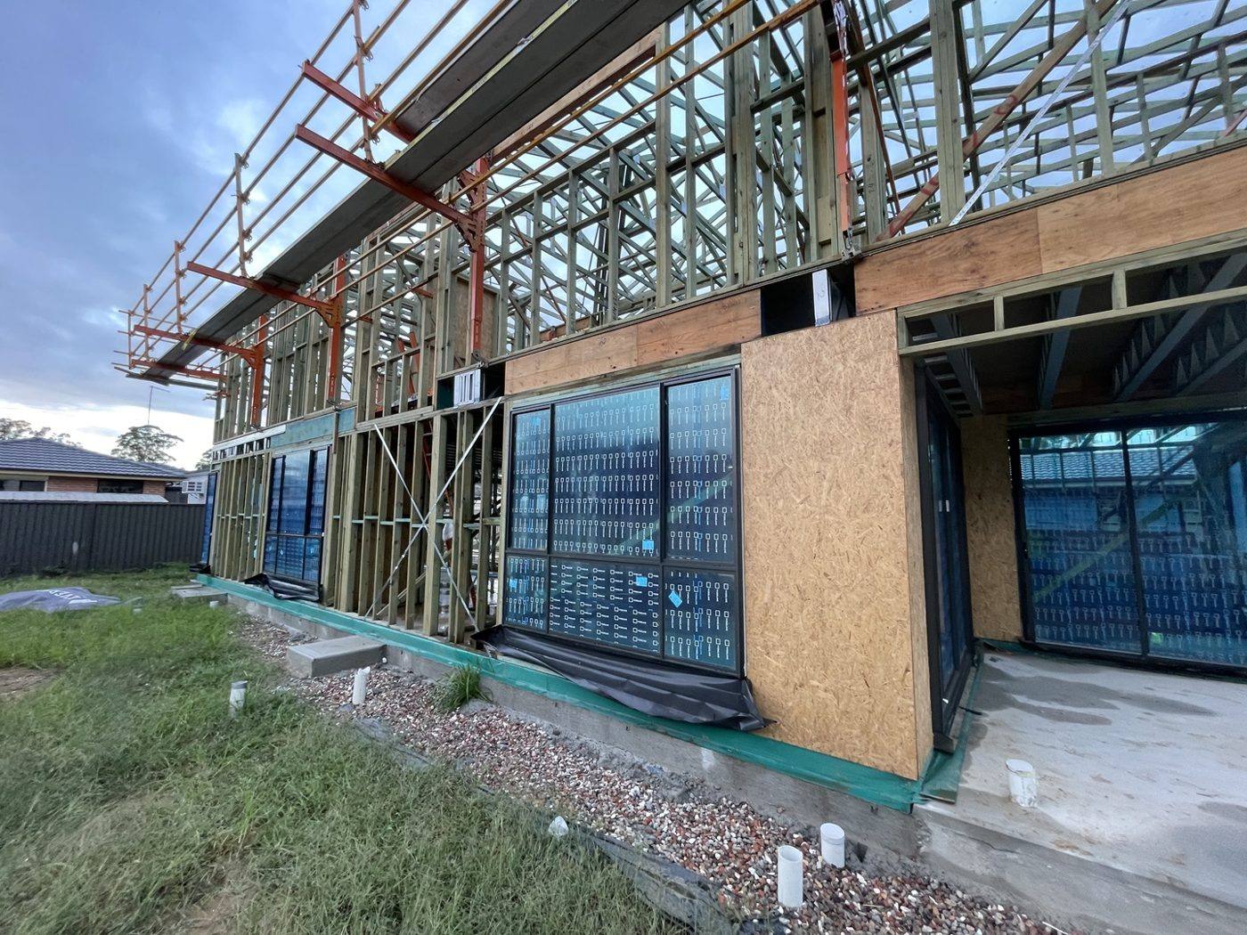 Wide view of framed window openings on a two-storey new build by Loel Homes