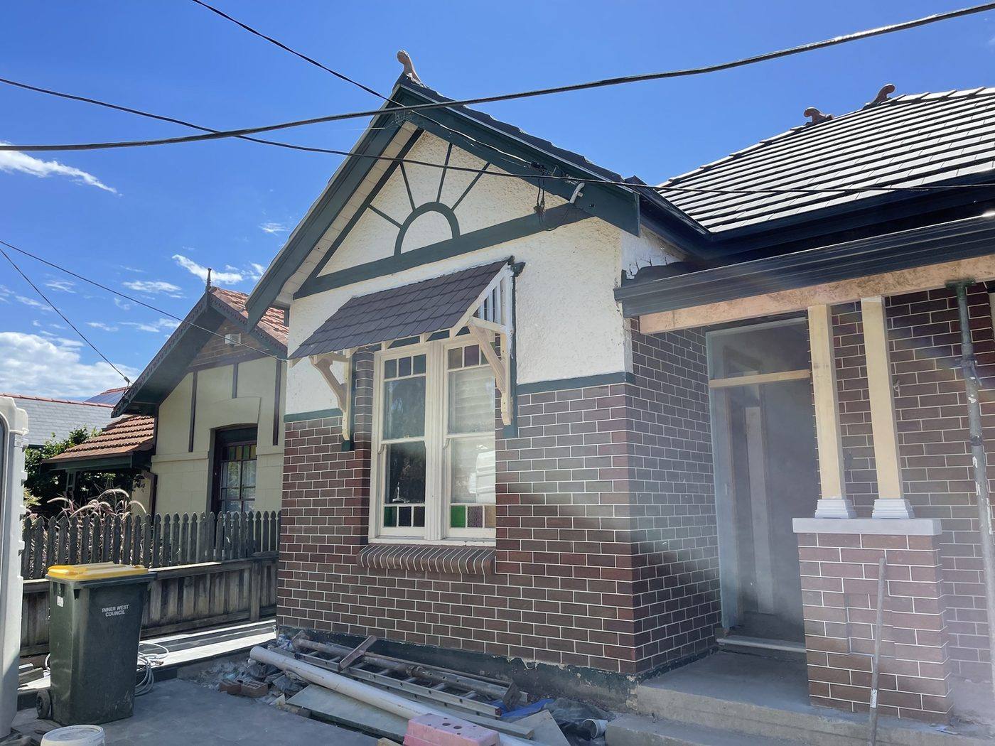 New face brickwork and rebuilt gable with sunburst fretwork on a Federation home, Inner West restoration by Loel Homes