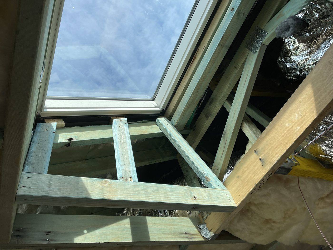 Roof window installed and flashed between the rafters, heritage terrace carpentry by Loel Homes